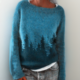 Handcrafted knit pullover in teal blue with dark tree motif on the front