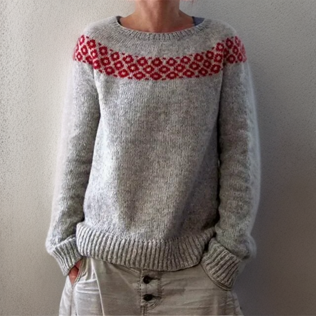Gray knit pullover sweater with red patterned yoke at crew neckline