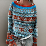 Blue knit loose pullover sweater with red crew neck and Nordic fair isle pattern