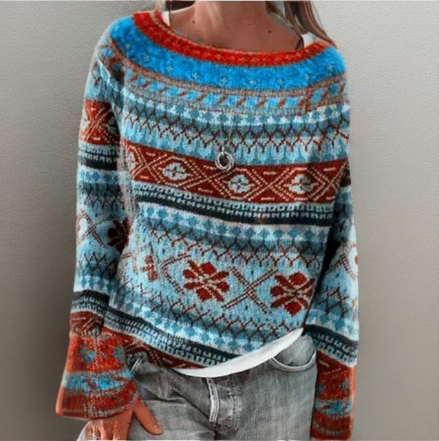 Blue knit loose pullover sweater with red crew neck and Nordic fair isle pattern