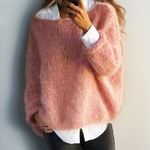 Rose-pink relaxed knit sweater with long sleeves and crew neckline