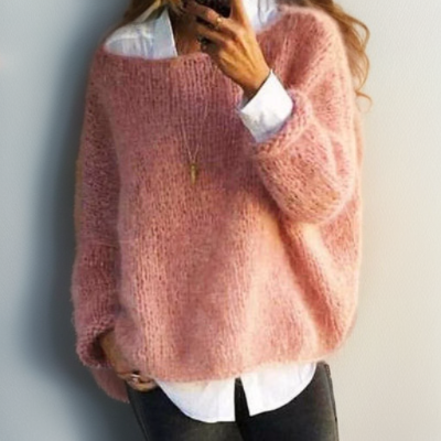 Rose-pink relaxed knit sweater with long sleeves and crew neckline