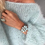 Light blue textured knit sweater with long sleeves and relaxed fit
