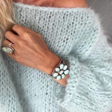 Light blue textured knit sweater with long sleeves and relaxed fit