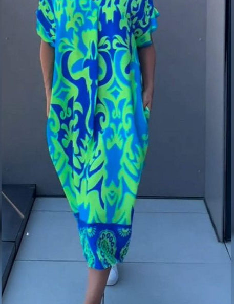 Floral midi dress with V-neck and short sleeves, bright green and blue pattern