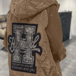 Khaki quilted hooded jacket with large back graphic and full-zip front