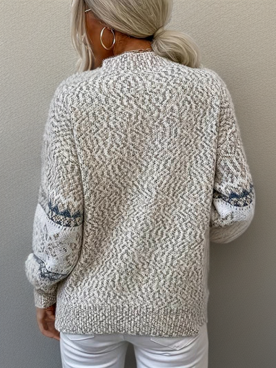 Back of cream knit sweater with textured stitch, crew neck, long sleeves, ribbed cuffs