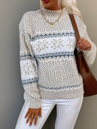 Cream knit sweater with blue fair isle stripe band and snowflake motifs, crew neck, long sleeves