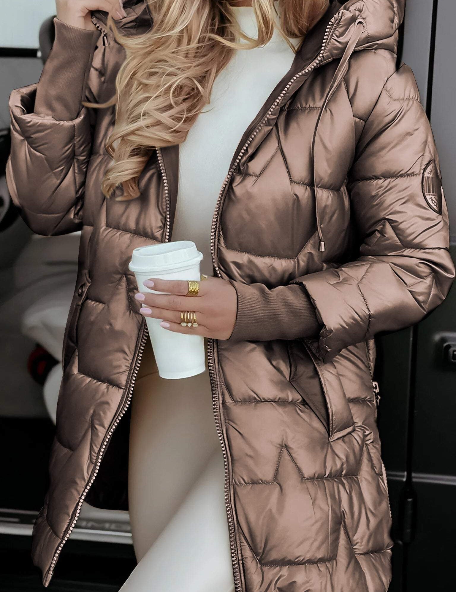 Brown quilted puffer jacket with full zip, hood, and gold trim hardware