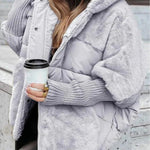 Light gray hooded puffer jacket with faux-fur trim and front zipper