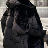 Black hooded puffer jacket with faux-fur hood panel and ribbed knit cuffs
