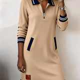 Beige long-sleeve cotton zip dress with navy striped cuffs and hem, patch pockets