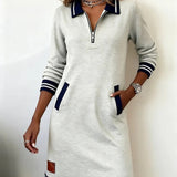 Long-sleeve cotton dress in off-white with half-zip, striped collar, cuffs, and pockets