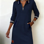 Long-sleeve cotton dress in navy with half-zip, striped collar, cuffs, and pockets