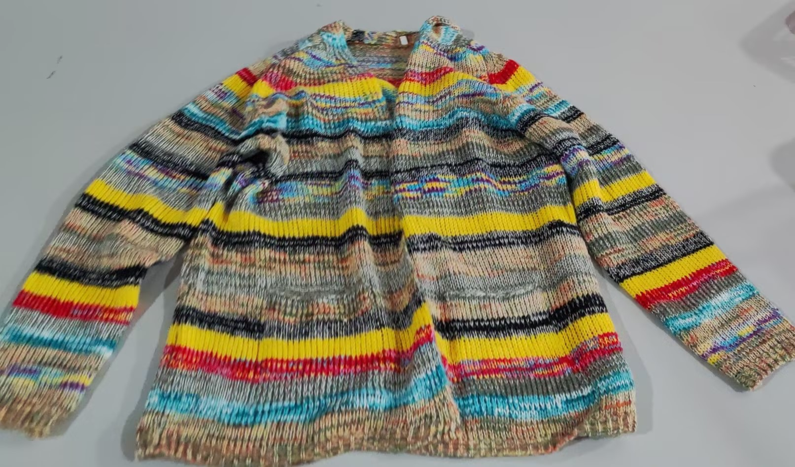 Multicolor striped knit sweater back view with ribbed collar and long sleeves