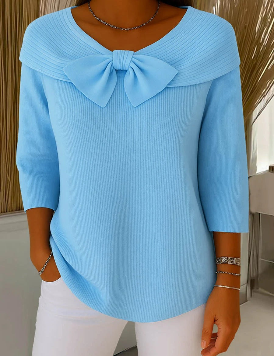 Light blue women's knit sweater with oversized bow at neckline, 3/4 sleeves