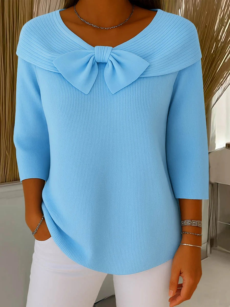 Light blue women's knit sweater with oversized bow at neckline, 3/4 sleeves