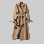 Beige trench coat front view with belt, double-breasted buttons, and shoulder tabs