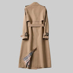 Beige trench coat back view with belt and buckled sleeve straps