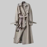 Light gray trench coat front view with belt, double-breasted buttons, and cuff tabs