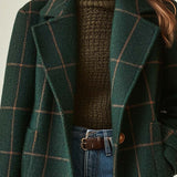 Women’s dark green plaid coat with notched lapels and button front, long sleeves