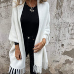 White long-sleeve wrap cardigan with fringe trim, draped open front and collar