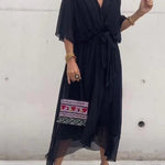 Black V-neck midi dress with draped sleeves and waist tie sash