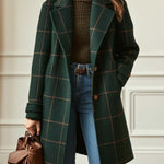 Women’s dark green plaid wool coat with lapels, front buttons, and long sleeves