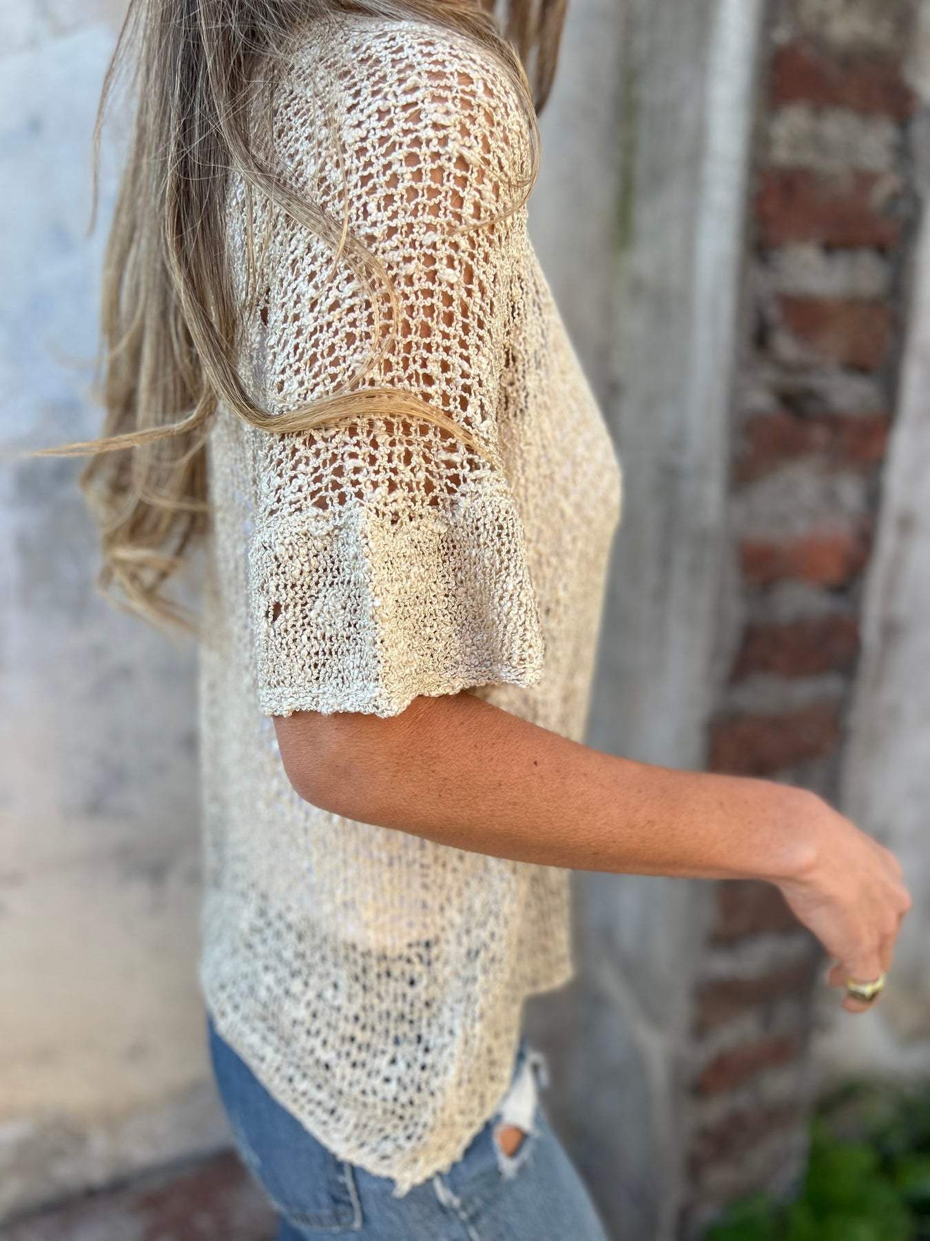 Textured knit V-neck short-sleeve top in light cream, side view