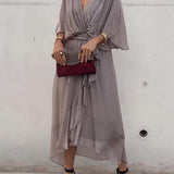 Gray V-neck midi dress with draped sleeves and tied waist belt