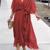 Red V-neck midi dress with draped sleeves and knotted waist belt