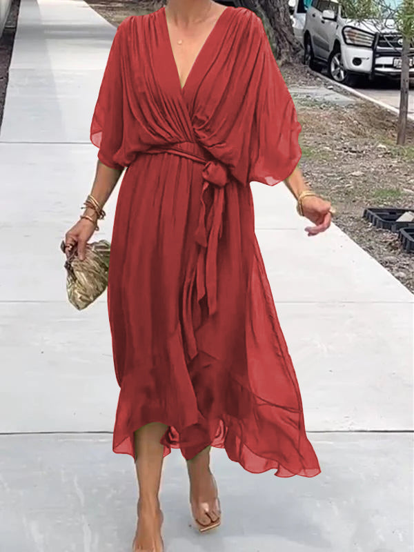 Red V-neck midi dress with draped sleeves and knotted waist belt