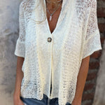 Textured V-neck short-sleeve button-front top in light cream, front view
