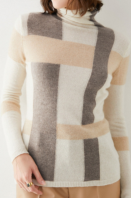 Color-block turtleneck sweater in cream with gray and beige panels, ribbed hem and cuffs