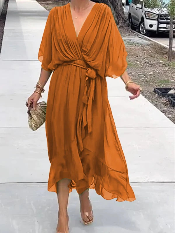 Rust orange V-neck midi dress with draped sleeves and waist tie detail