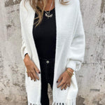 White long-sleeve wrap cardigan with fringe at cuffs and hem, open front