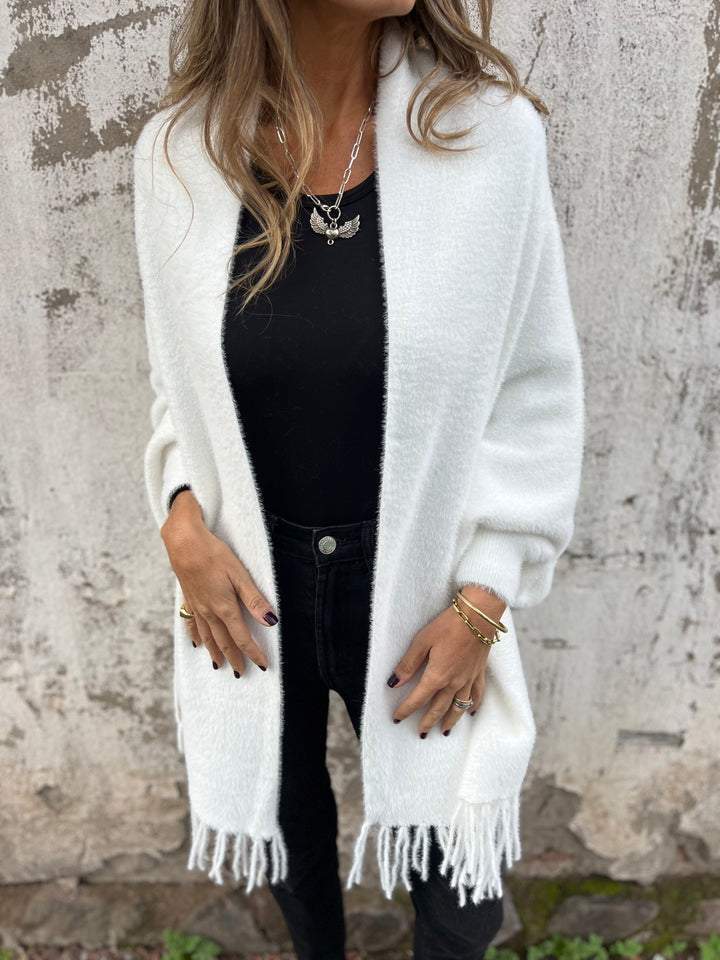White long-sleeve wrap cardigan with fringe at cuffs and hem, open front