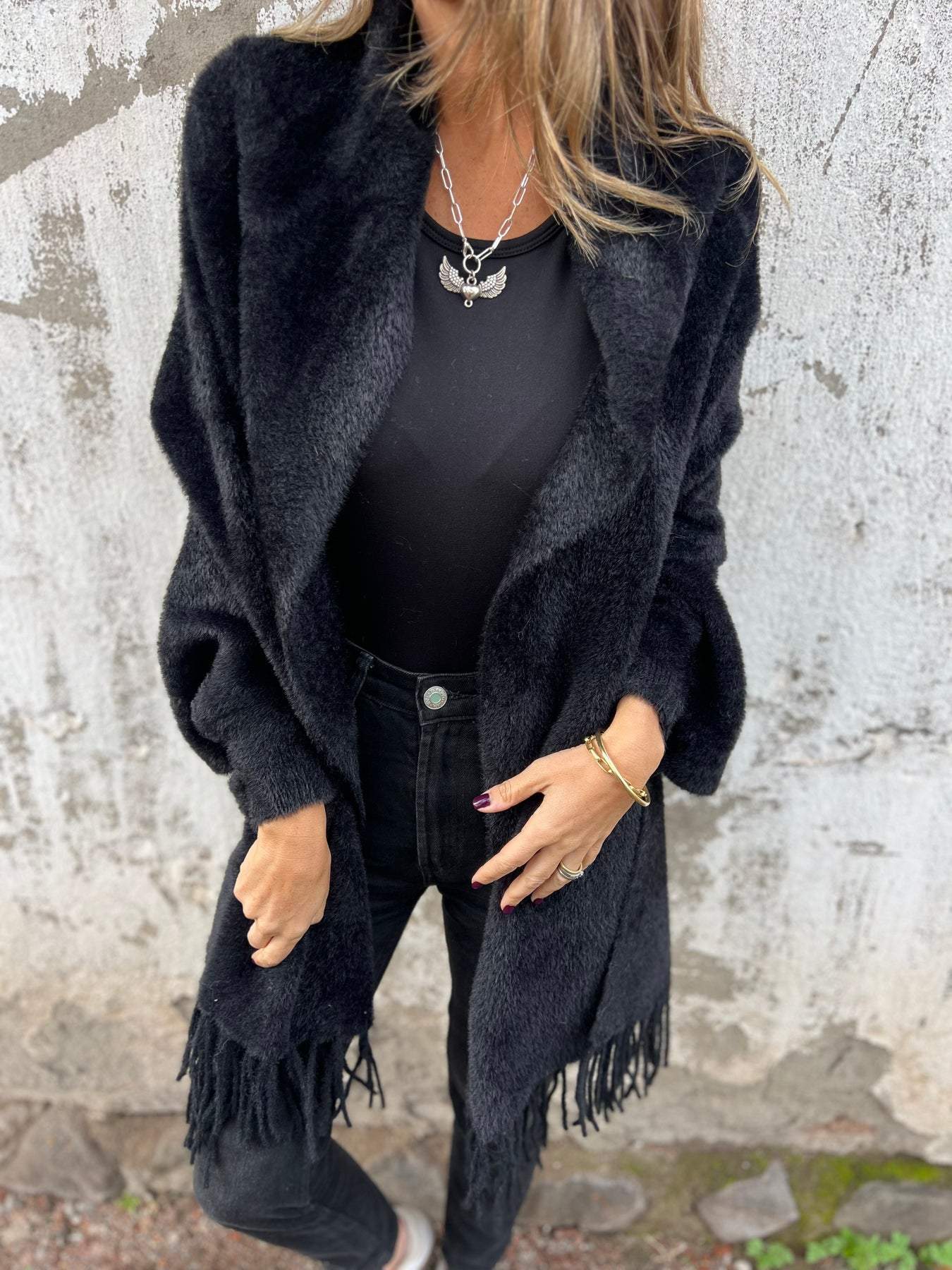 Black long-sleeve wrap cardigan with fringe cuffs and hem, open front