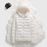 White hooded puffer jacket with full zipper and plush faux-fur trim around hood