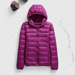 Purple hooded puffer jacket with full-length zipper, quilted pattern, long sleeves