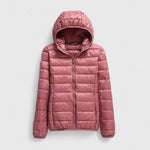 Pink hooded puffer jacket with full-length zipper, quilted padding, long sleeves