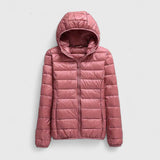 Pink hooded puffer jacket with full-length zipper, quilted padding, long sleeves