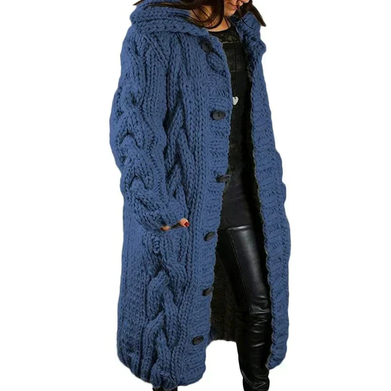 Women's long cable-knit cardigan in dark blue with button front and textured sleeves.
