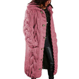 Women's long cable-knit cardigan in dusty rose with button front and textured pattern.