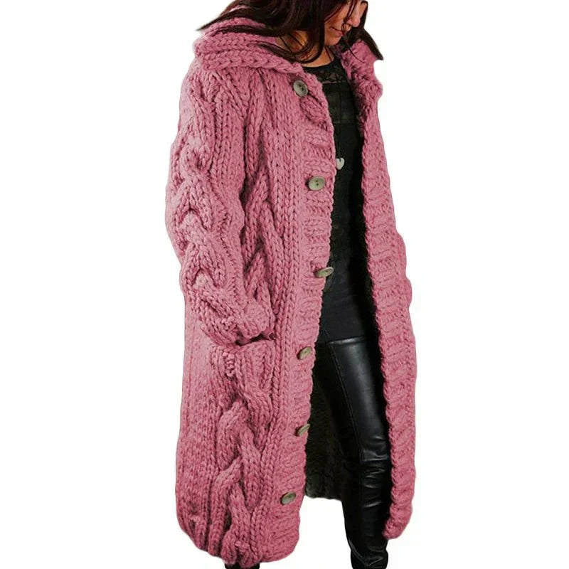 Women's long cable-knit cardigan in dusty rose with button front and textured pattern.
