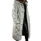 Women's long cable-knit cardigan in off-white with button front and textured cable knit.