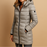 Light gray quilted puffer jacket with front zip, stand collar, button cuffs