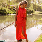 Red sleeveless midi dress, high neck, gathered back, side slit