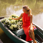 Red sleeveless midi dress with ruched bodice and long side slit