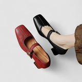 Red and black orthopedic Mary Jane heeled shoes with buckle strap